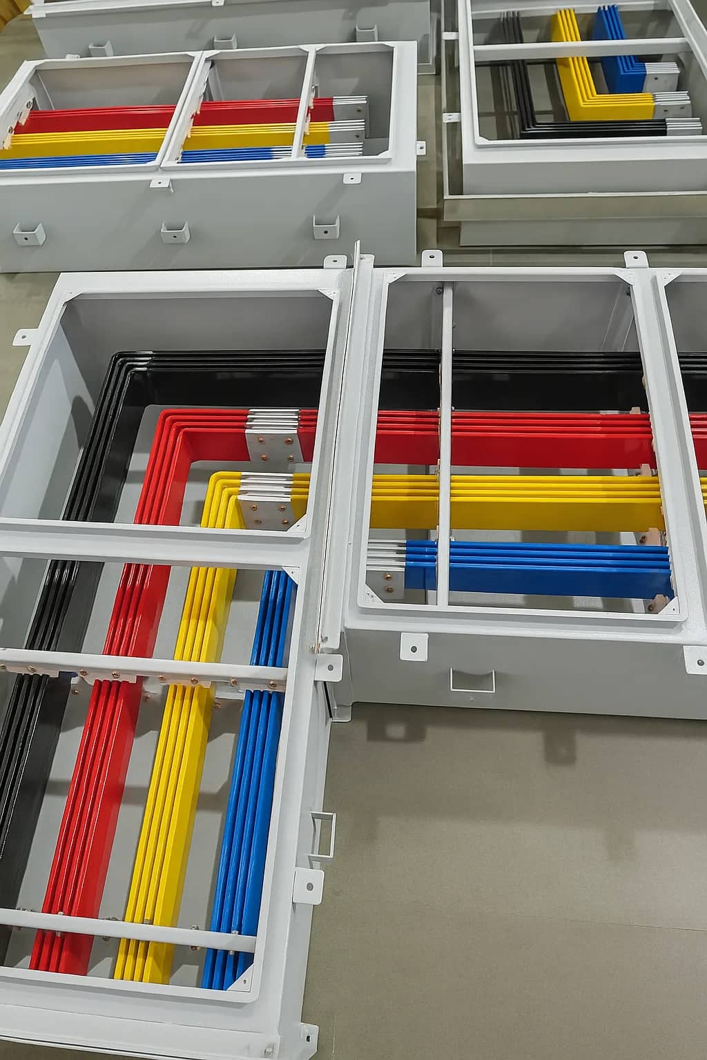 Bus duct sections showing insulated copper conductors inside the enclosure